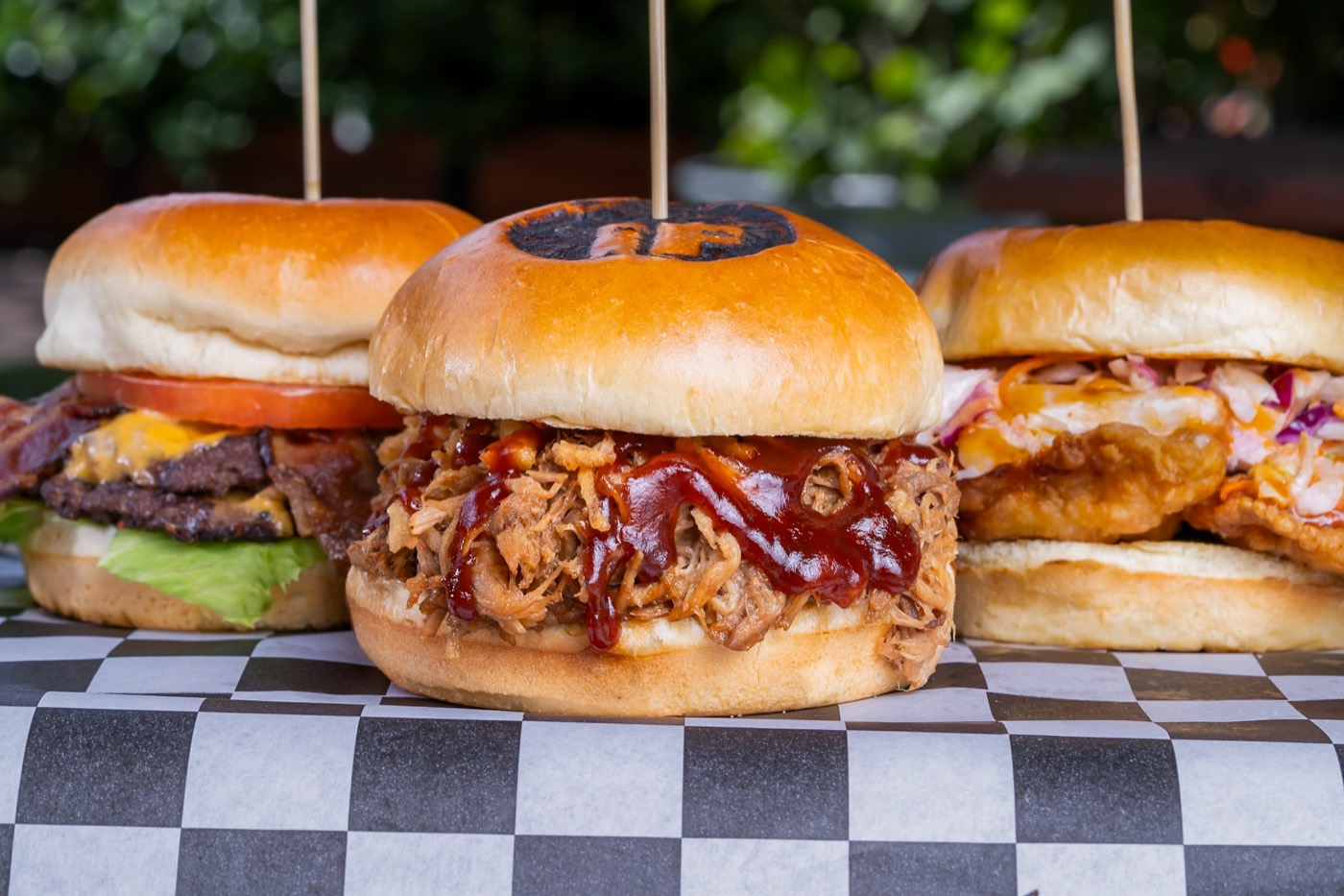 Trio of Latin Fixin's crafted burgers